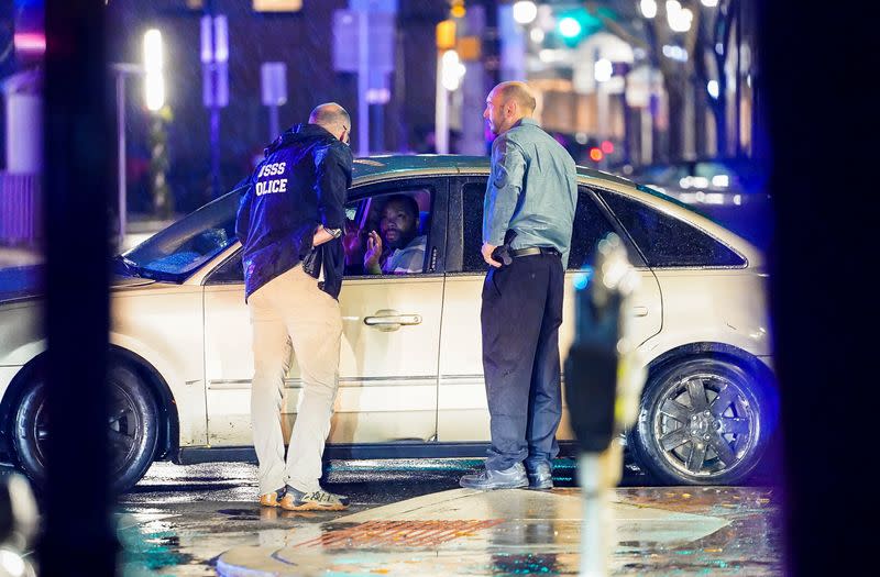 Members of the United States Secret Service react to a vehicle crashing into a Secret Service SUV that was blocking the street, in Wilmington