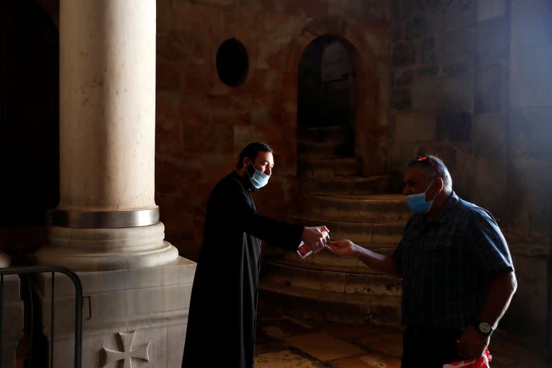 Church of the Holy Sepulchre reopens its doors following the easing of the novel coronavirus restrictions, in Jerusalem's Old City