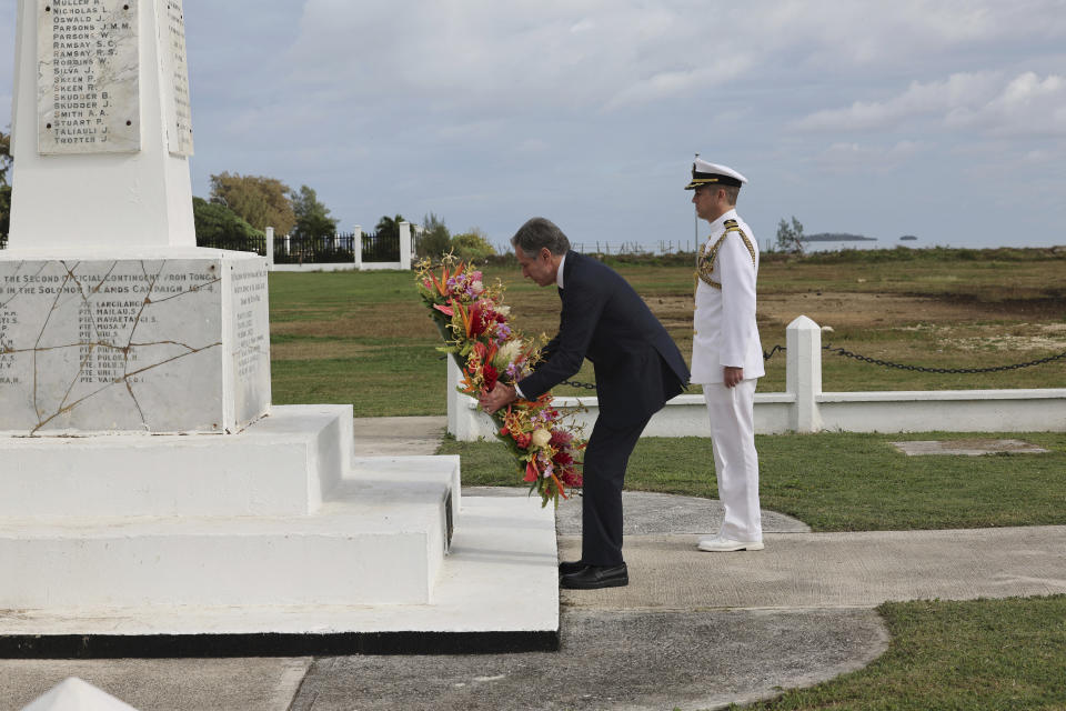 U.S. Secretary of State Antony Blinken, left, attends a wreath-laying ceremony at Tonga's War Memorial in Nuku'alofa, Tonga Wednesday, July 26, 2023. (Tupou Vaipulu/Pool Photo via AP)