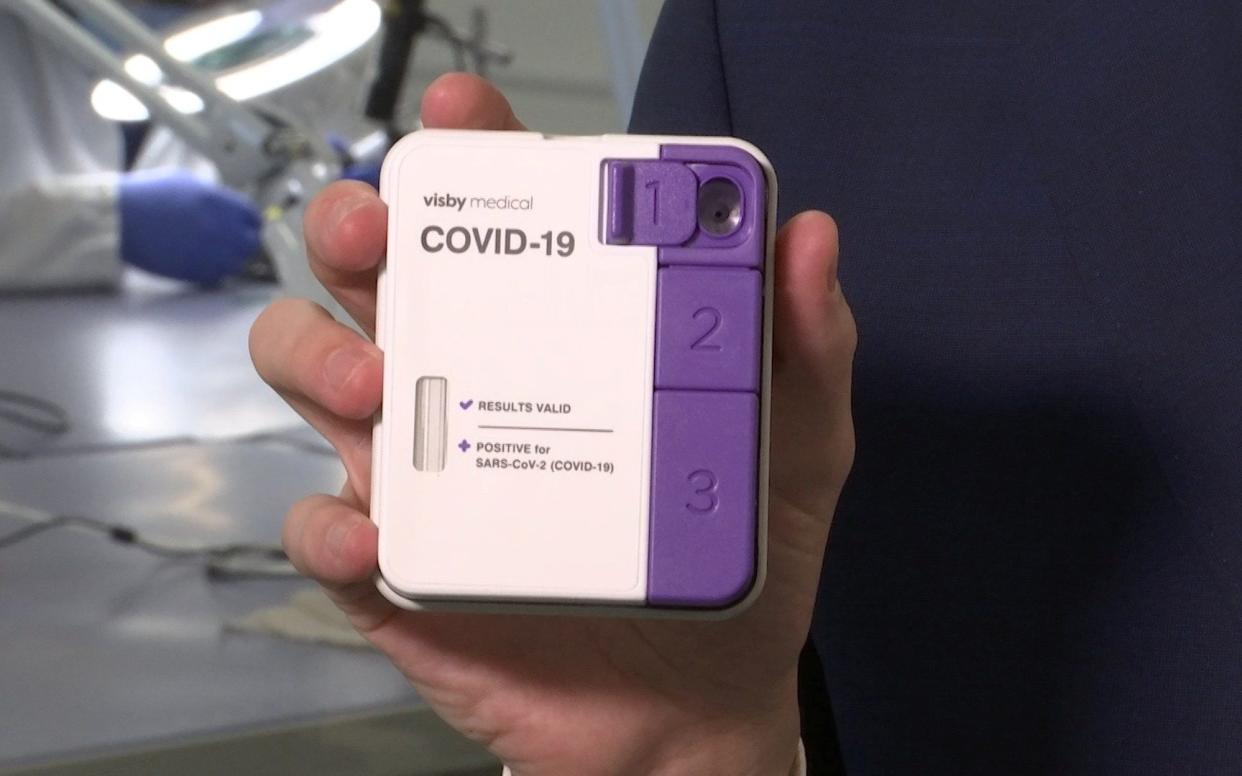 Visby Medical's CEO Adam de la Zerda holds the company's portable PCR COVID-19 test kit, now approved for use in clinical labs under an FDA emergency use authorization - REUTERS