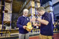 International Development Minister Desmond Swayne (left) is shown a Lifesaver Cube by Head of Humanitarian Response DFID Dylan Winder (right) during a visit to DFIDâs UK Disaster Response Operations Centre at Cotswold Airport, Kemble.