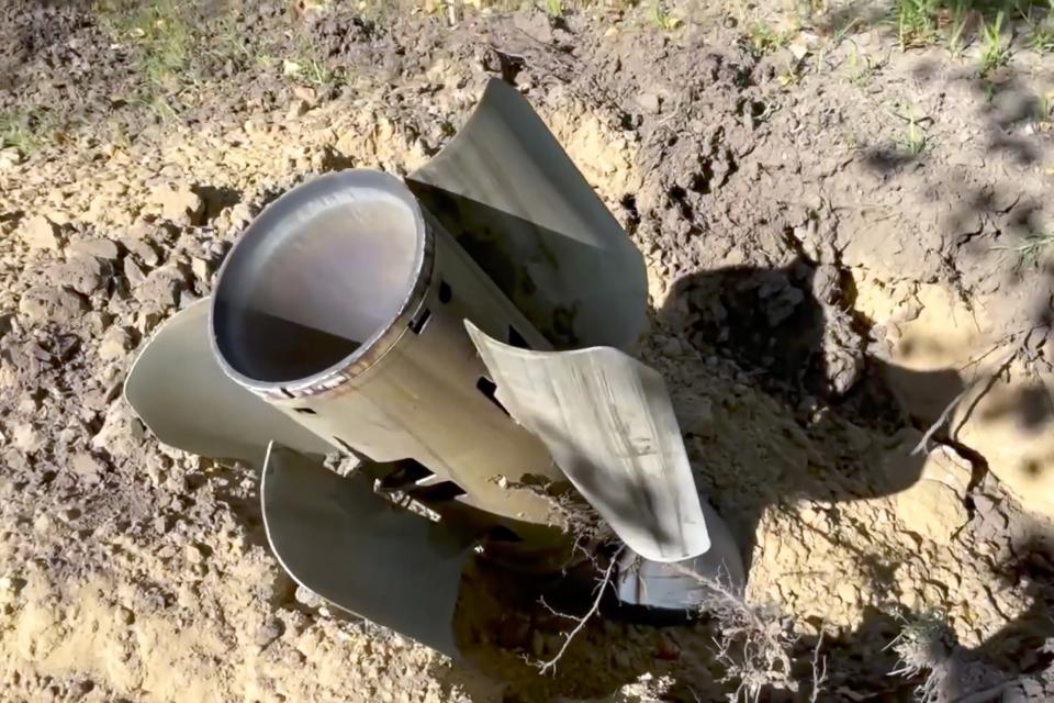 In this handout photo taken from video and released by Russian Defense Ministry Press Service on Sunday, Aug. 7, 2022, A rocket fragment after shelling is seen near the Zaporizhzhia Nuclear Power Station in territory under Russian military control, southeastern Ukraine. The Russian military said that Ukrainian shelling of the Zaporizhzhia nuclear plant on Sunday caused a power surge and fire and forced staff to lower output from two reactors. (Russian Defense Ministry Press Service via AP)