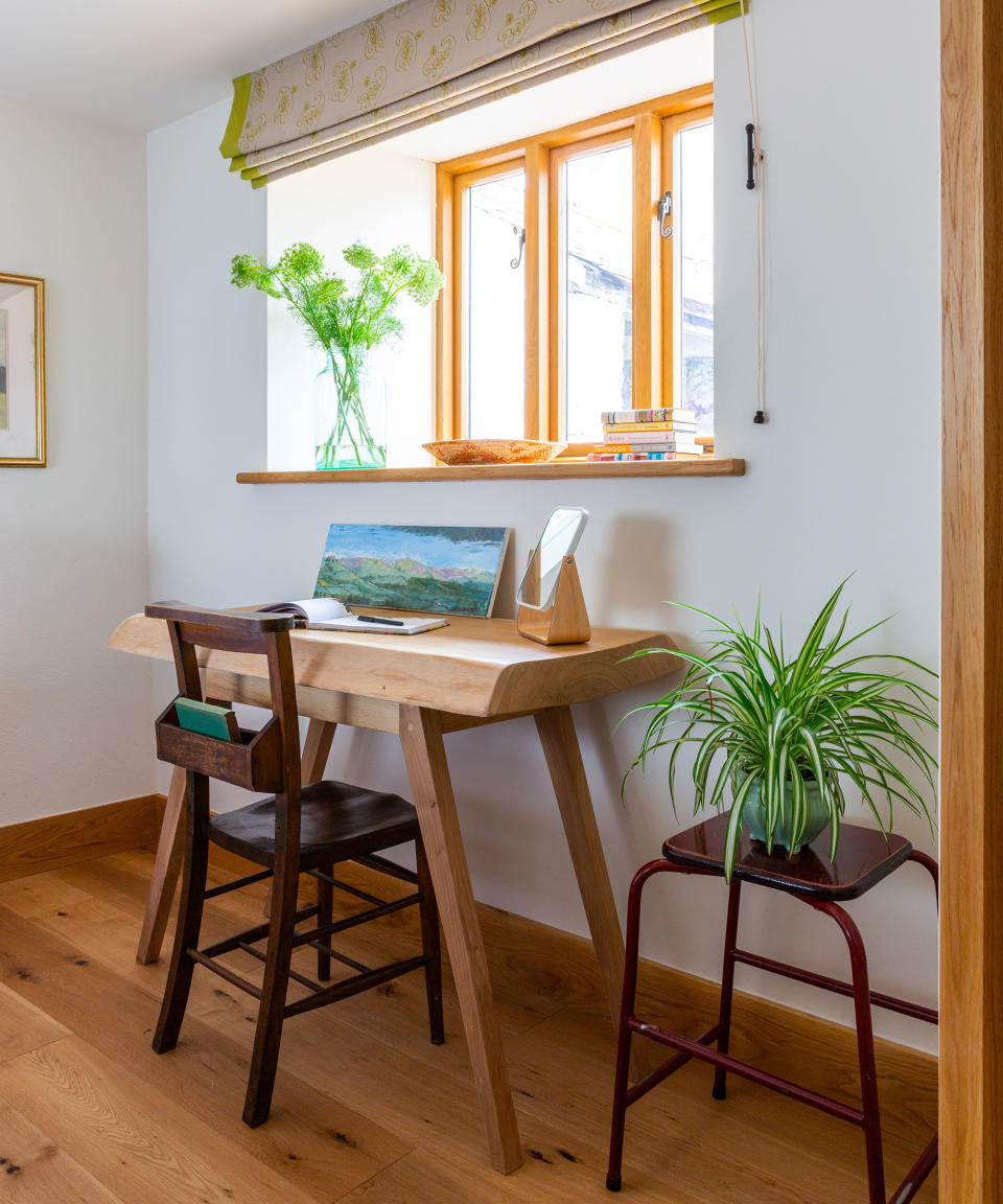 home office with a desk and spider plant on a small table