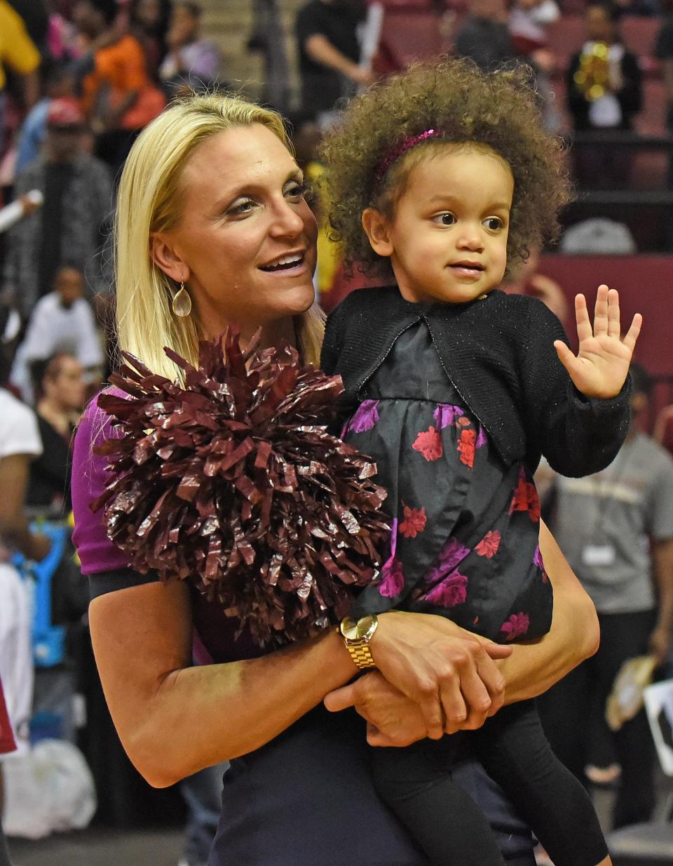 Florida State head coach Brooke Wyckoff with her daughter Avery in a 2021 photo.