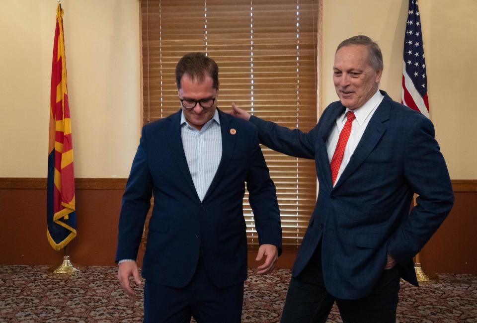 Rep. Andy Biggs (right) greets Chairman Jake Hoffman after an Arizona Freedom Caucus press conference on July 22, 2022, in the historic Senate Chamber at Arizona State Capitol in Phoenix.