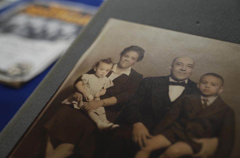 A family portrait of Frankie and Charles Pace with their children, Frances and Frank Jr., is displayed at the University of Pittsburgh, on Tuesday, Feb. 28, 2023, in Pittsburgh. After cleaning and organizing 14 crates that made up the Pace archive, a music historian discovered that the late gospel composer Charles Henry Pace was an early pioneer of gospel music whose independently owned publishing company helped elevate and expand the genre. (AP Photo/Jessie Wardarski)