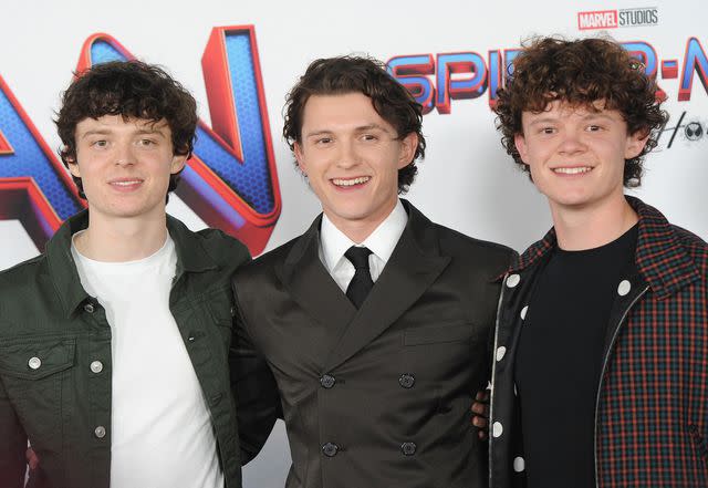 <p>Albert L. Ortega/Getty</p> Sam Holland, Tom Holland and Harry Holland at the Spider-Man: No Way Home Los Angeles Premiere in 2021