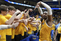 Pittsburgh forward Blake Hinson (2) celebrates with fans after defeating Miami, 71-68, during an NCAA college basketball game in Pittsburgh, Saturday, Jan. 28, 2023. (AP Photo/Matt Freed)