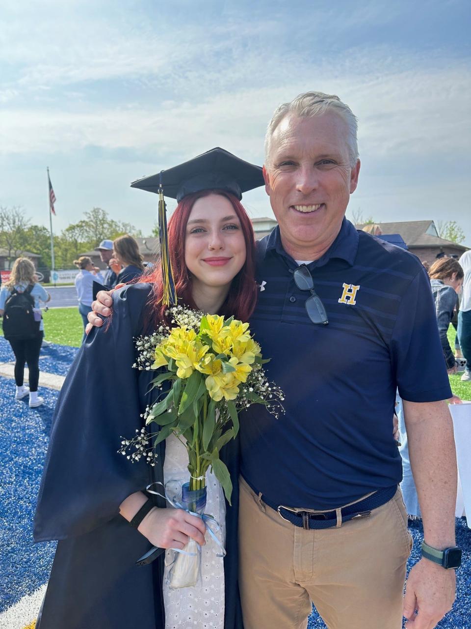 Ethan Hawker is the Hartland Consolidated Schools Teacher of the Year for 2024. In this photo, he poses with his daughter.
