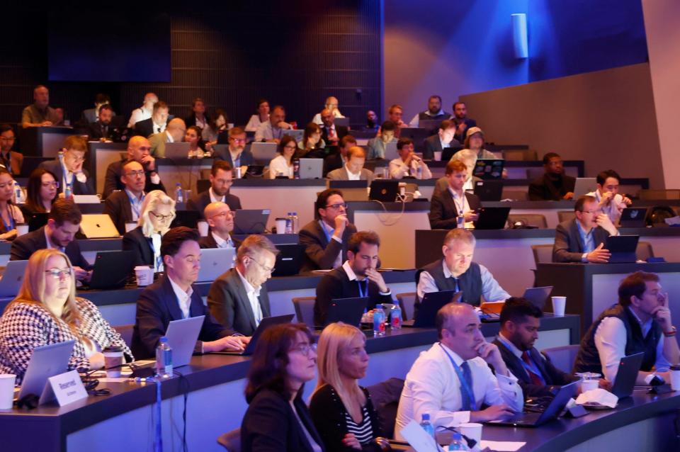 Investors inside the amphitheater at Stellantis listen to a speaker before hearing from Carlos Tavares, CEO of Stellantis during Stellantis Investor Day at their corporate headquarters in Auburn Hills on Thursday, June 13, 2024.