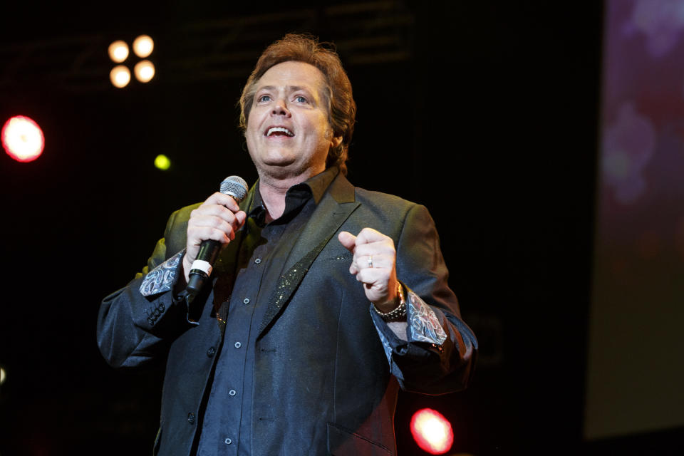 MANCHESTER, UNITED KINGDOM - JUNE 20: (EXCLUSIVE COVERAGE) Jimmy Osmond of The Osmonds performs on stage at Phones 4 U Arena on June 20, 2014 in Manchester, United Kingdom. (Photo by Andrew Benge/Redferns via Getty Images)