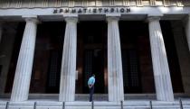 A man enters the old Stock Exchange building in central Athens, Greece, July 7, 2015. REUTERS/Jean-Paul Pelissier