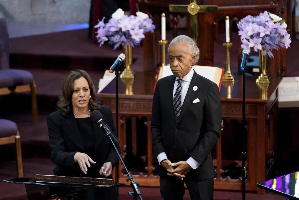 Vice President Kamala Harris speaks alongside the Rev. Al Sharpton during a memorial service for Ruth Whitfield, a victim of the Buffalo supermarket shooting, at Mt. Olive Baptist Church, Saturday, May 28, 2022, in Buffalo, N.Y. (AP Photo/Patrick Semansky)