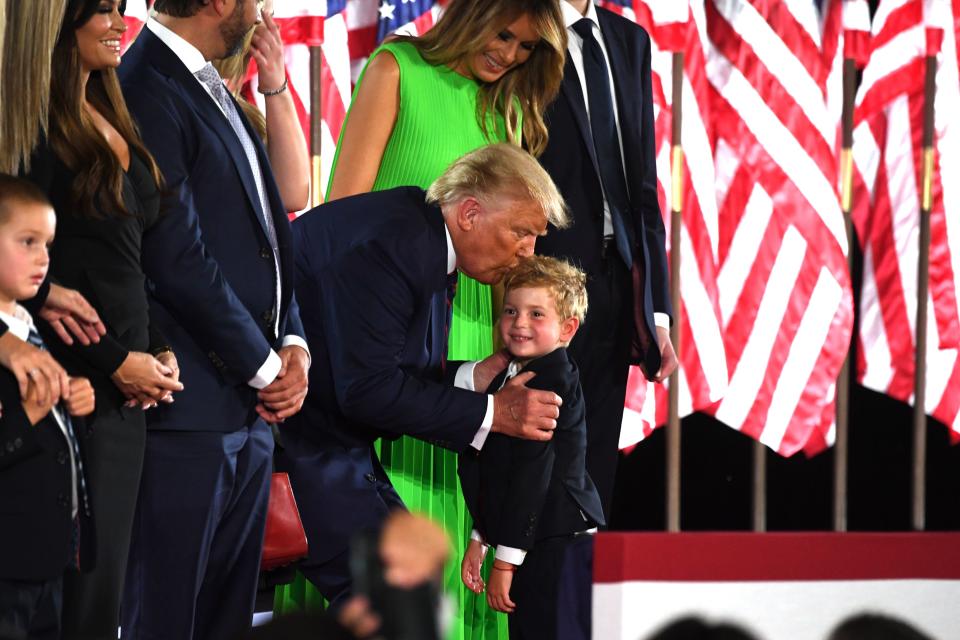 First Lady Melania Trump looks on as US President Donald Trump kisses grandson Theodore James Kushner after he delivered his acceptance speech for the Republican Party nomination for reelection during the final day of the Republican National Convention at the South Lawn of the White House in Washington, DC on August 27, 2020. (Photo by SAUL LOEB / AFP) (Photo by SAUL LOEB/AFP via Getty Images)