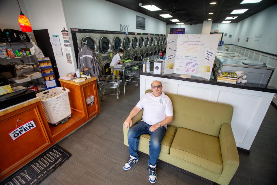 Mark Csordos, owner of Washing Well, sits in his new business in Aberdeen Twp., NJ Tuesday May 9, 2023. Csordos started a successful business, wrote a book about entrepreneurship and was featured in the New York Times all before the age of 30. But he found himself bouncing among retail jobs and fighting depression. Now 52, he has purchased the laundromat in a move that he hopes will allow him to find contentment once again.