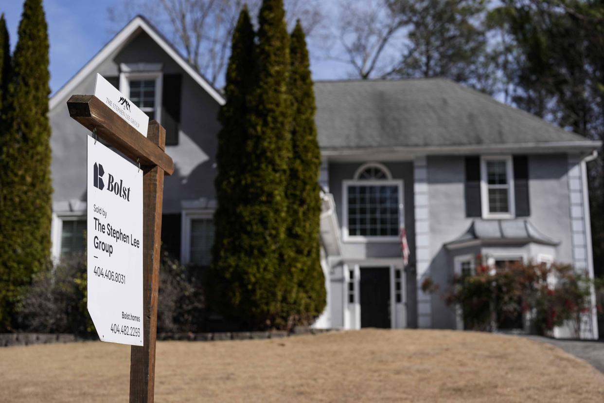 FILE - A sign announcing a home for sale is posted outside a home on Feb. 1, 2024, in Kennesaw, Ga., near Atlanta. On Thursday, March 14, 2024, Freddie Mac reports on this week's average U.S. mortgage rates. (AP Photo/Mike Stewart, File)