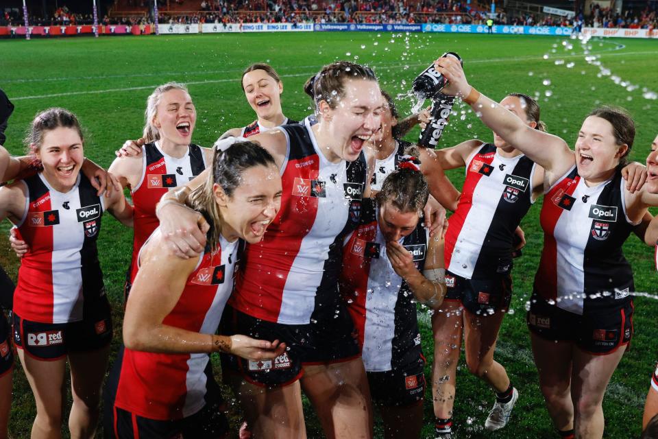 The St Kilda Saints sing the team song after their round one AFLW win against the Sydney Swans in Sydney, Australia.