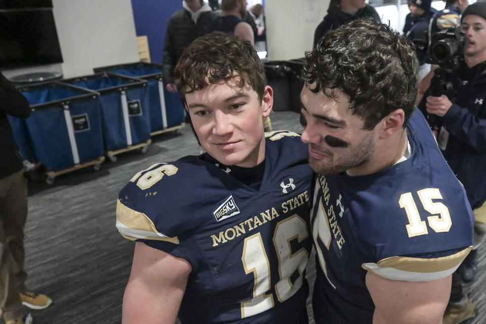 FILE - Montana State quarterback Tommy Mellott (16) and linebacker Troy Andersen (15) react in the locker room after Montana State beat South Dakota State 31-17 in the semifinals of an NCAA college football game in the FCS playoffs, Saturday, Dec. 18, 2021, in Bozeman, Mont. Mellott accounted for 11 touchdowns (six rushing, four passing, one receiving) in his first three career starts, all in the Football Championship Subdivision playoffs. He has 411 yards rushing and 449 passing this postseason.(AP Photo/Tommy Martino, File)