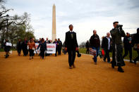 <p>Attendees are seen during a silent march and rally on the National Mall to mark the 50th anniversary of the assassination of slain civil rights leader Rev. Martin Luther King Jr. in Washington, April 4, 2018. (Photo: Eric Thayer/Reuters) </p>