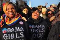 Rickita Glass (L) and Kelly Grimes and others gather near the U.S. Capitol building on the National Mall for the Inauguration ceremony on January 21, 2013 in Washington, DC. U.S. President Barack Obama will be ceremonially sworn in for his second term today. (Photo by Joe Raedle/Getty Images)