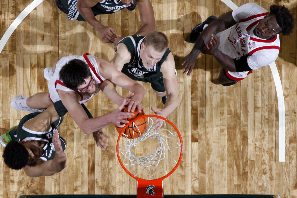 Michigan State's Malik Hall, from left, Nebraska's Wilhelm Breidenbach, Michigan State's Joey Hauser, and Nebraska's Derrick Walker vie for a rebound during the second half of an NCAA college basketball game, Tuesday, Jan. 3, 2023, in East Lansing, Mich. Michigan State won 74-56. (AP Photo/Al Goldis)