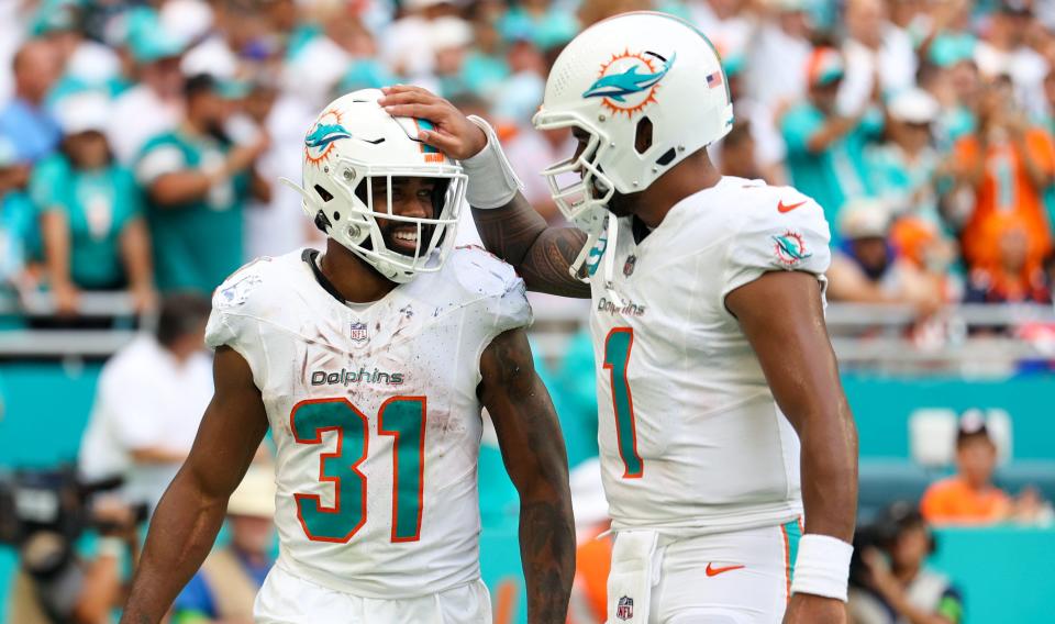 Dolphins running back Raheem Mostert (31), shown with Tua Tagovailoa, will be looking forward to a meeting with his former team, the 49ers.