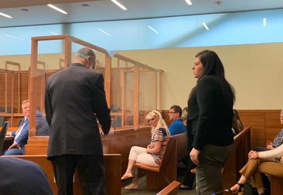 Bria K. Henslee, 23, right, enters a Franklin County Common Pleas courtroom on Tuesday for her murder trial in the death of 25-year-old Makaela Ellis on April 9, 2021. According to Columbus police, Henslee ran over Ellis with her car in the parking lot of a Kentucky Fried Chicken restaurant on Harrisburg Pike on the Southwest Side. Sam Shamansky, left, one of Henslee's defense attorneys, said during opening arguments on Tuesday that Ellis was pointing a gun at Henslee, who acted in self-defense.