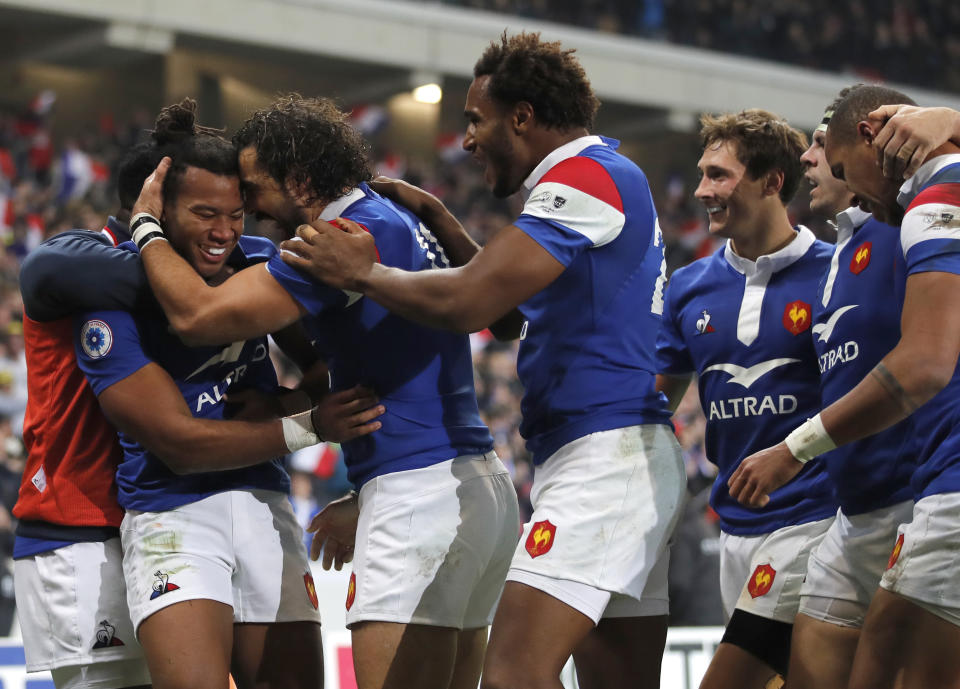 French rugby players celebrate after France's Teddy Thomas, left, scored a try during their rugby union international match between France and Argentina at the Pierre Mauroy stadium, in Lille, northern France, Saturday, Nov. 17, 2018. (AP Photo/Christophe Ena)