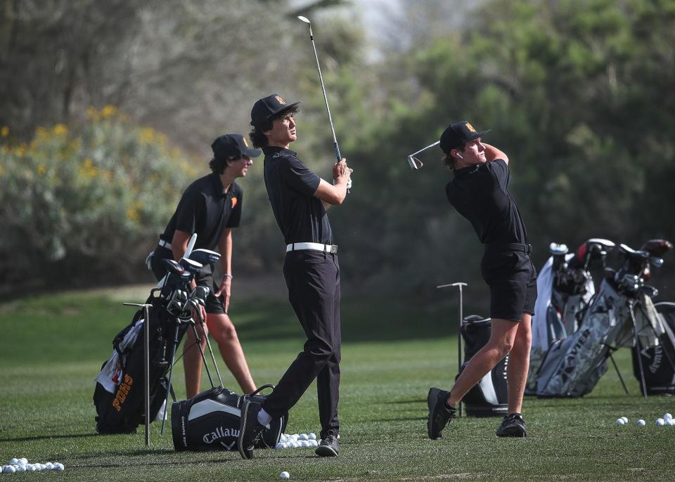 Members of the Palm Desert High School golf team practice on the range at Desert Willow Golf Resort in Palm Desert, Calif., Feb. 29, 2024.