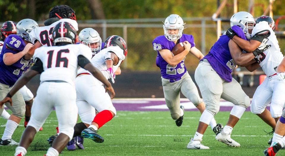 South's Ben Morrison (23) runs during the Bloomington South versus New Albany football game at Bloomington High School South Friday, August 20, 2021.