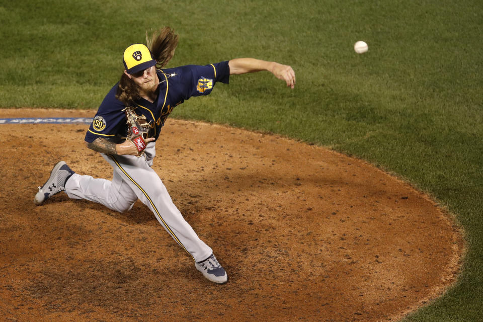 Milwaukee Brewers relief pitcher Josh Hader delivers during the ninth inning of a baseball game against the Chicago Cubs, Friday, Aug. 14, 2020, in Chicago. (AP Photo/Jeff Haynes)