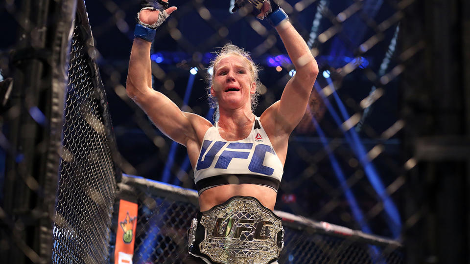 Holly Holm reacts after knocking out Ronda Rousey to win the UFC women's bantamweight title. (Getty)