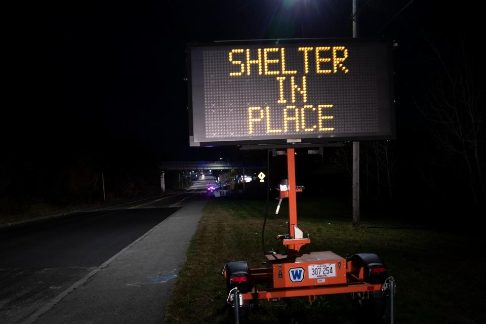 A sign telling the public to shelter for their own safety (AP)