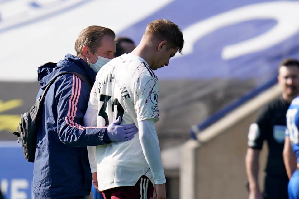 <p>Injury blow: Arsenal’s Emile Smith Rowe limped off before half-time against Leicester</p> (POOL/AFP via Getty Images)