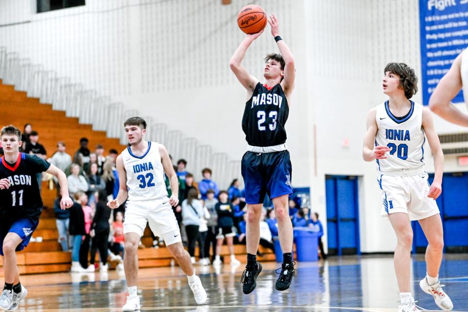 Mason's Levi Stambaugh scores against Ionia during the third quarter on Tuesday, Jan. 24, 2023, at Ionia High School.