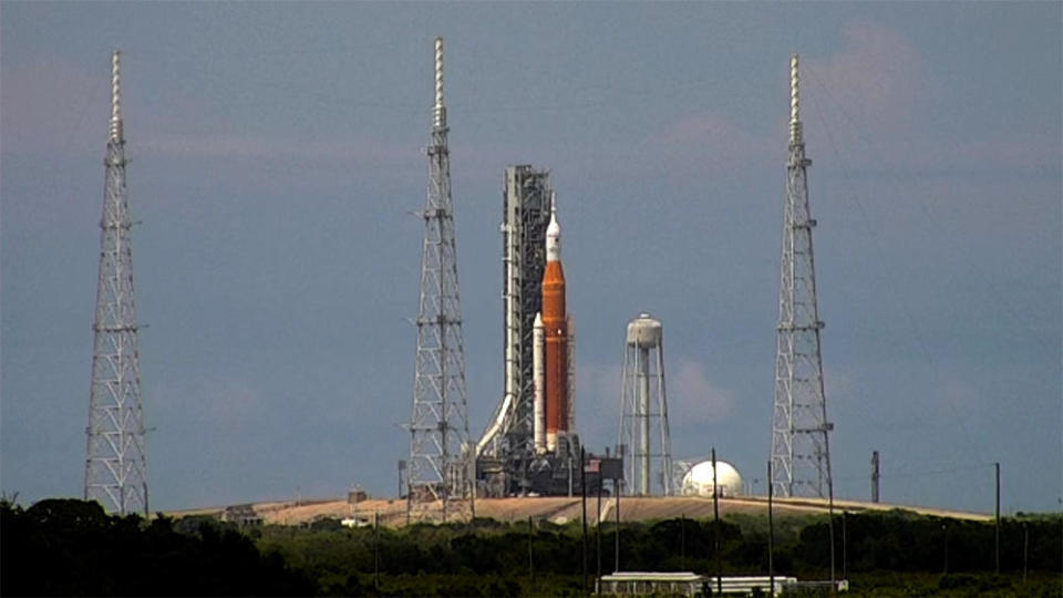 Back atop pad 39B, the SLS moon rocket will be prepared for another attempt to complete a dress-rehearsal countdown and fueling test around June 19. If the test goes well, NASA hopes to launch the rocket on a maiden test flight in late August, boosting an unpiloted Orion crew capsule beyond the moon and back. / Credit: CBS News
