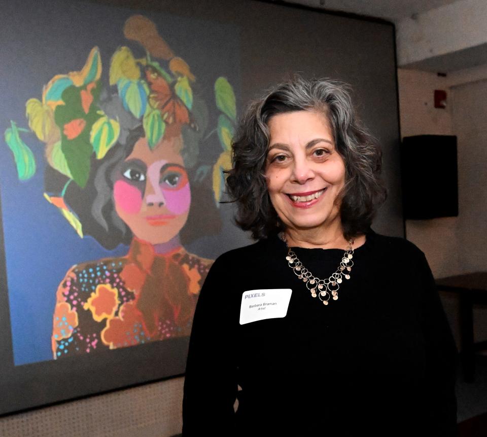 Barbara Braman, a winner of the "Pixels" digital art exhibit competition, with a projection of her work at the Cape Cod Museum of Art in Dennis.