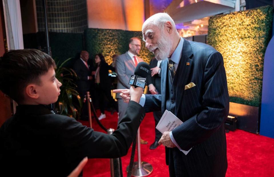 Renowned computer scientist Vinton Cerf, right, known as the Father of the internet, talks with a member of a student media team from Elk Grove on the red carpet before being inducted into the California Hall of Fame on Tuesday. Lezlie Sterling/lsterling@sacbee.com