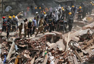 <p>Firefighters and rescue workers search for survivors at the site of a collapsed building in Mumbai, India, Aug. 31, 2017. (Photo: Shailesh Andrade/Reuters) </p>