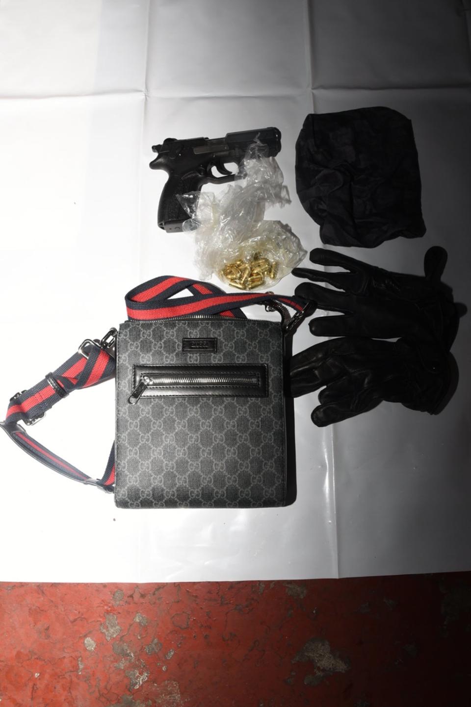 Marius Molla kept a gun in a Gucci manbag (SEROCU Police)