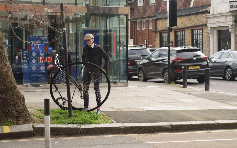 Television presenter Jeremy Vine with his penny-farthing bicycle in Chiswick High Road -  Peter Hogan / Alamy 