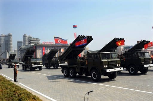 North Korean soldiers ride on the back of MLRS (mutliple launch rocket system) vehicles during a military parade in Pyongyang on April 15, 2012. North Korea has apparently finished preparations for a third nuclear test at its underground site at Punggye-ri, in the northeast of the country, according to South Korean nuclear experts