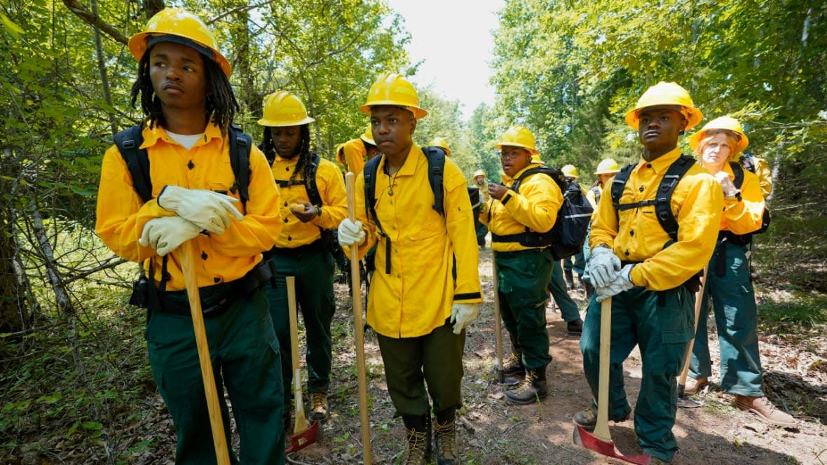 Wildland firefighter students from Alabama A&M and Tuskegee universities listen during a wildland firefighter training last month in Hazel Green, Alabama. A partnership between the U.S. Forest Service and four historically Black colleges and universities is opening the eyes of students of color who had never pictured themselves as fighting forest fires. (Photo: George Walker IV/AP)