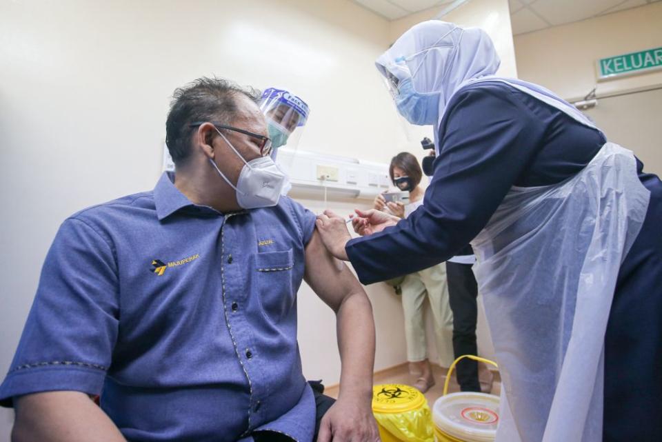 Private companies vaccinate their employees under the Silver Vax Programme at the Ar-Ridzuan Hospital in Ipoh August 2, 2021. —Picture by Farhan Najib