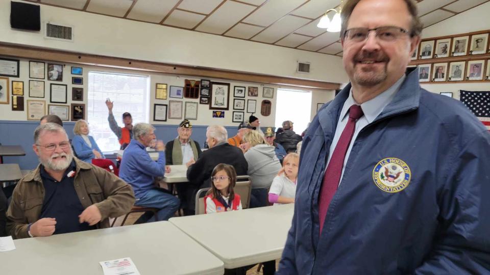 U.S. Congressman Chuck Edwards smiles as he is greeted by veterans at American Legion Post 77 on Veterans Day in Hendersonville.