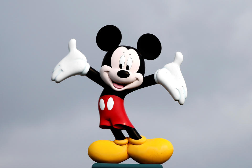 Disney character Mickey Mouse is seen above the entrance of Disneyland Paris, in Marne-la-Vallee, near Paris, France, March 9, 2020, where a maintenance worker was tested positive for coronavirus over the weekend.  REUTERS/Benoit Tessier