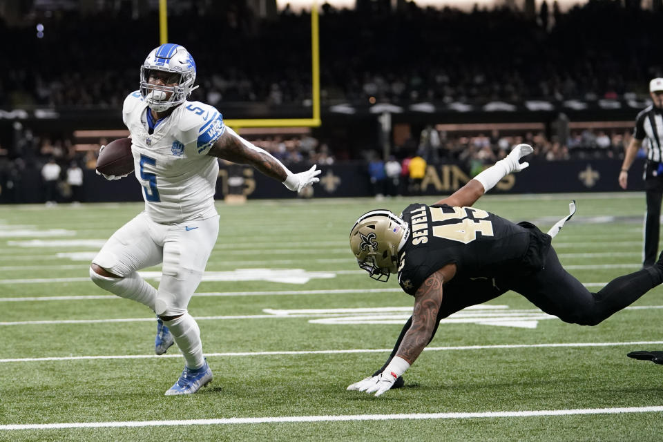 David Montgomery (5) and the Lions held off the Saints to move to 9-3. (AP Photo/Gerald Herbert)