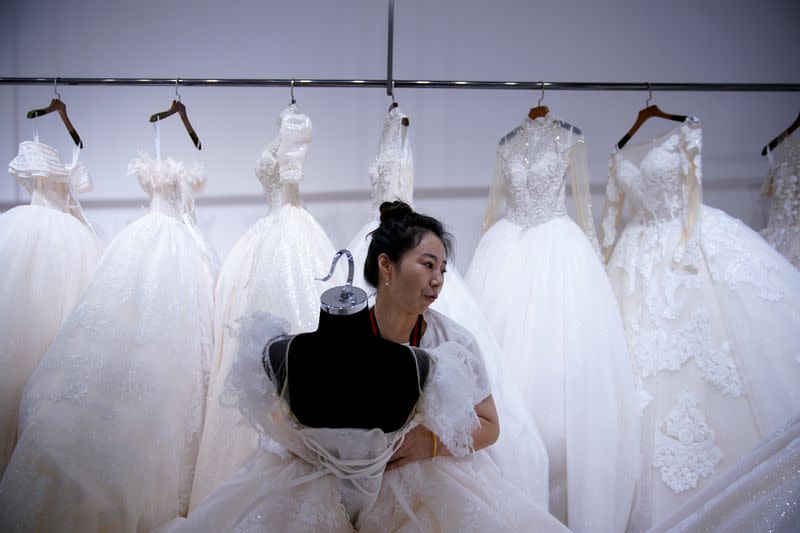 The Wider Image: Coronavirus dampens celebrations in China's wedding gown city