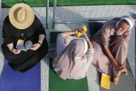 Nuns wait for the start of a vigil held by PopeFrancis at Campus Misericordiae in Brzegi, near Krakow, Poland, Saturday, July 30, 2016. (AP Photo/Czarek Sokolowski)