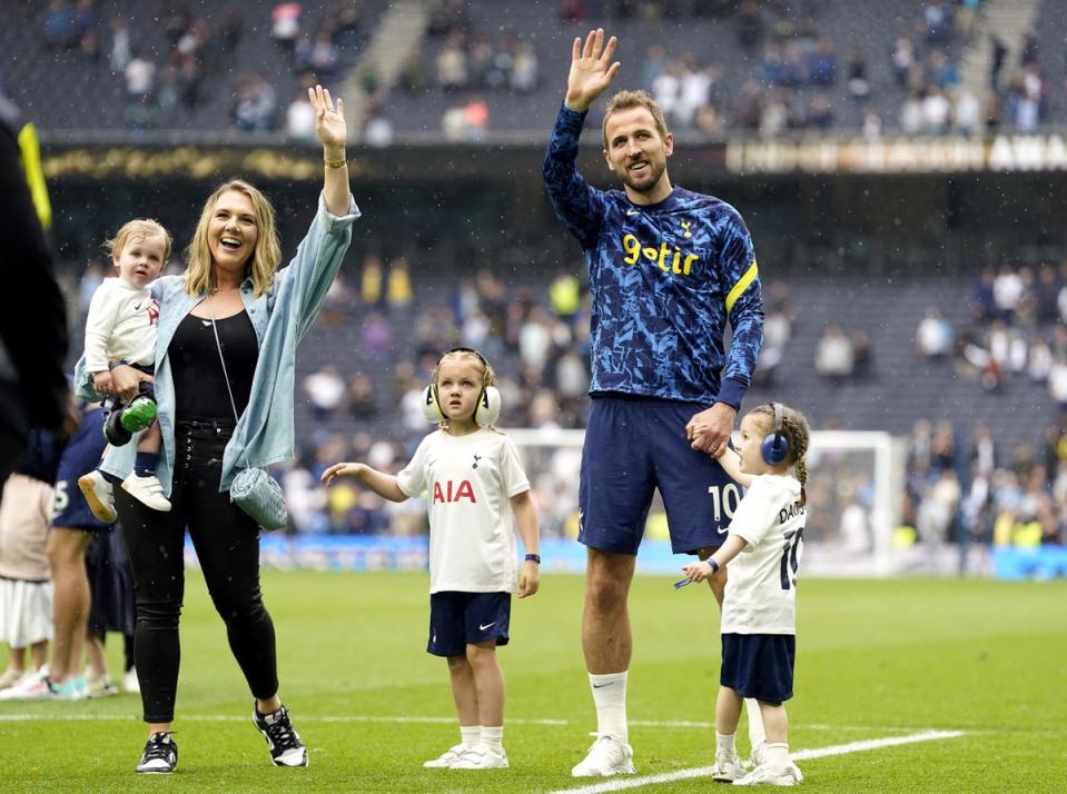 Harry Kane with wife Katie Goodland and their children Ivy, Vivienne Jane and Louis on the pitch after the Premier League match at the Tottenham Hotspur Stadium in 2022 (PA)